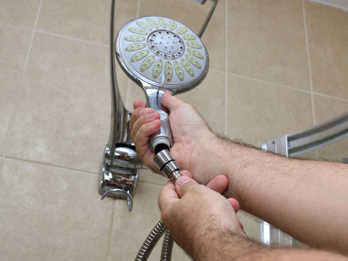 person holding a shower head